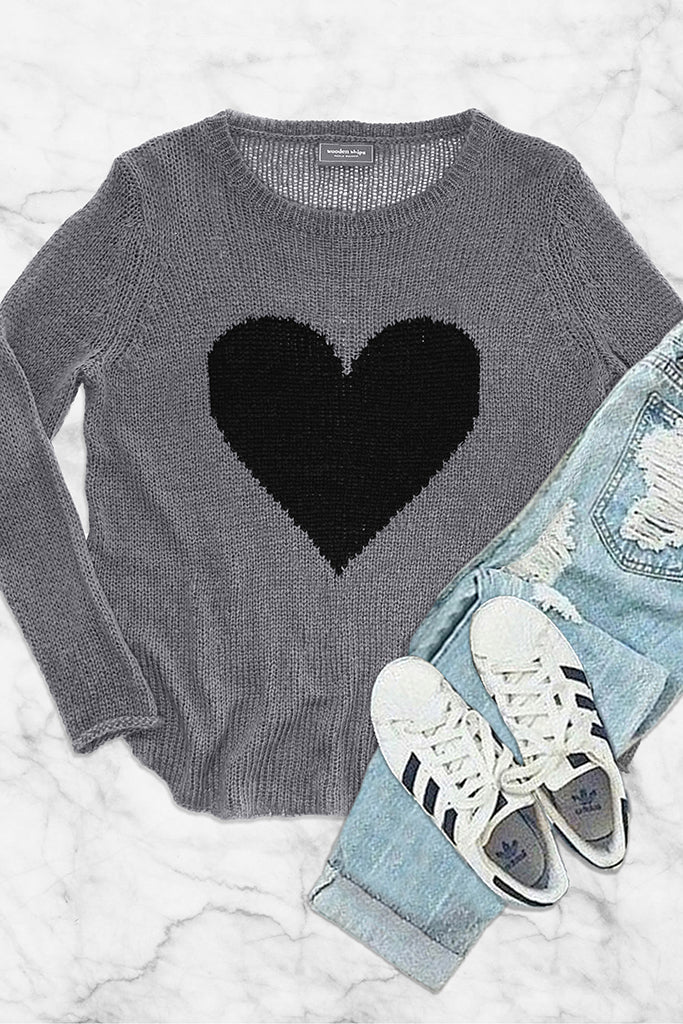 White sweater with black hearts sale